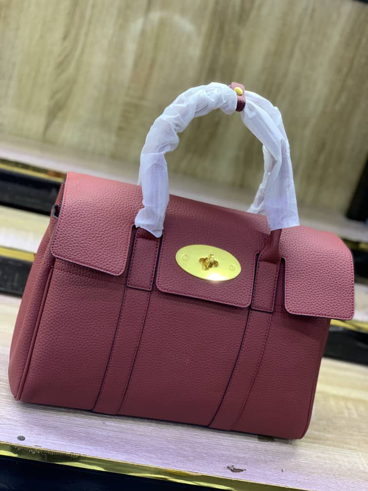 Leather Top-handle satchel handbag with a gold-tone turn-lock clasp