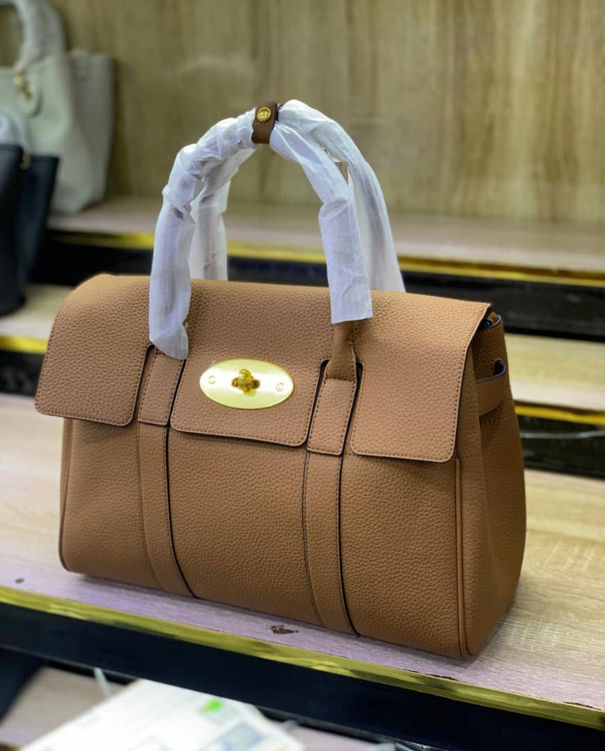 Leather Top-handle satchel handbag with a gold-tone turn-lock clasp