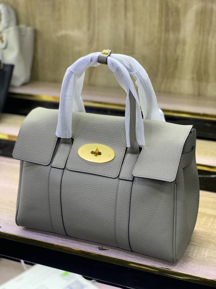 Leather Top-handle satchel handbag with a gold-tone turn-lock clasp