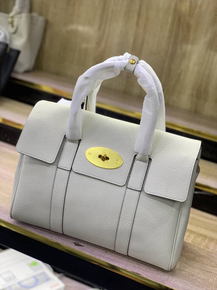 Leather Top-handle satchel handbag with a gold-tone turn-lock clasp