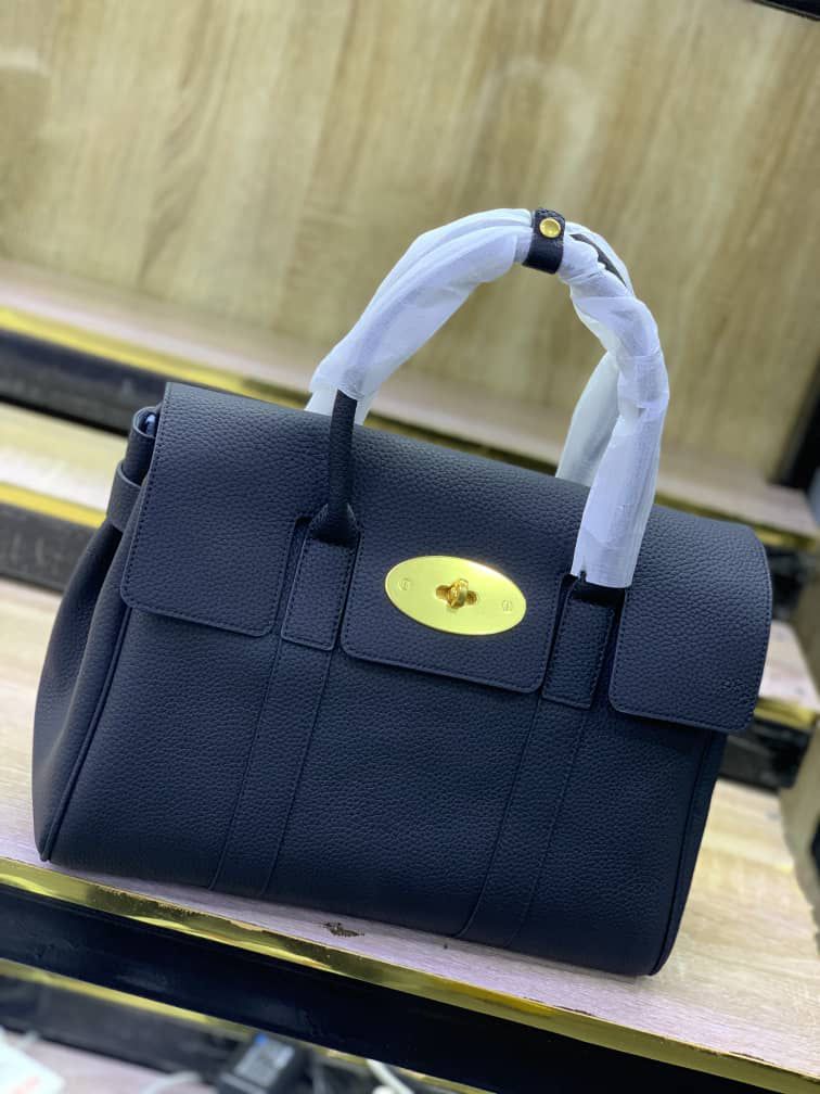 Leather Top-handle satchel handbag with a gold-tone turn-lock clasp