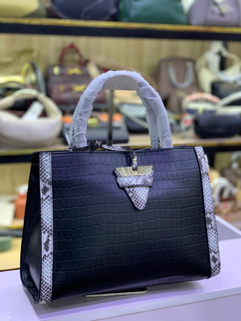 Designer Handbag with Triangular Strap